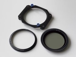 Benro 100mm holder and two 95mm mount rings, one with a polarizer installed.